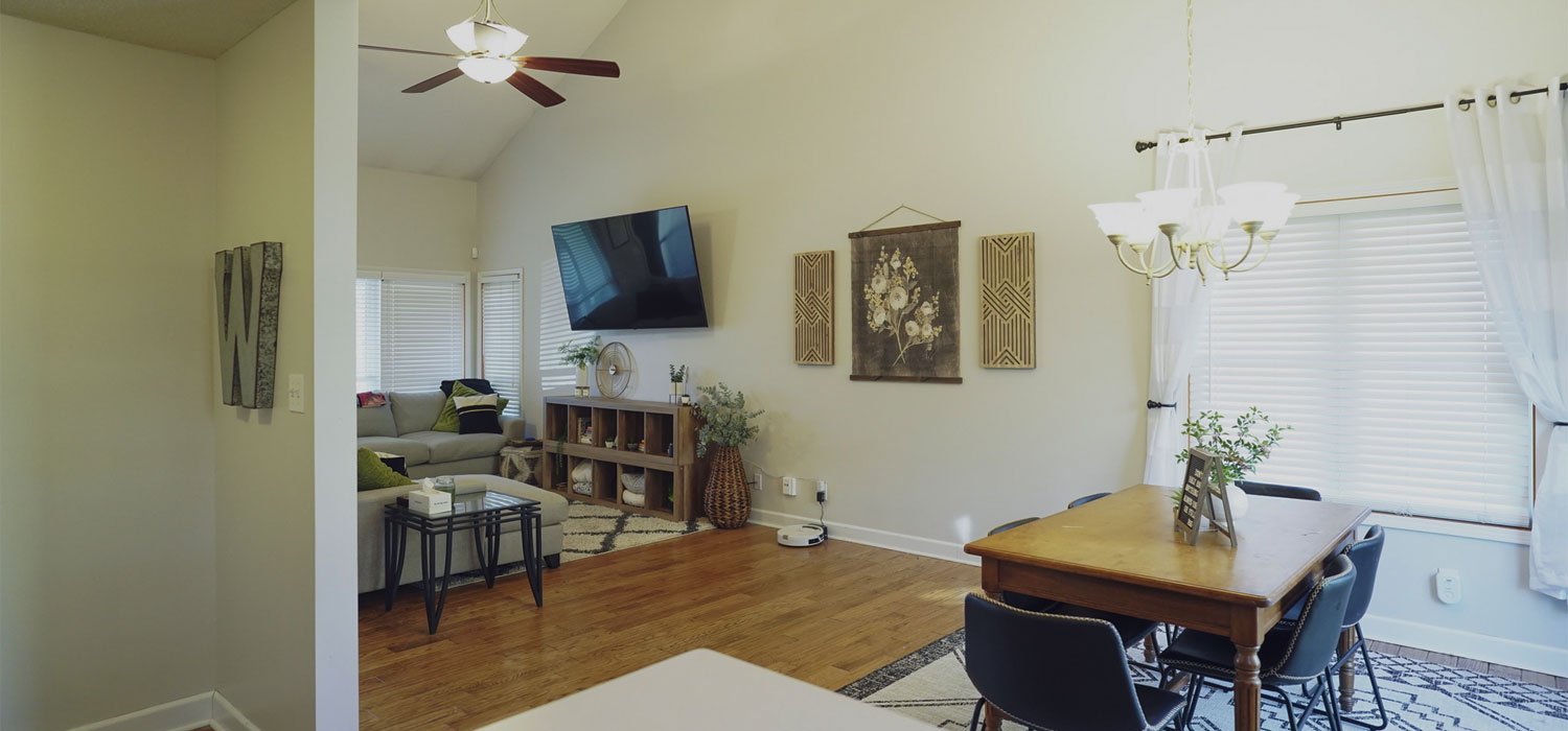 Open living and dining room with soft gray walls, painted by painters near Topeka, KS